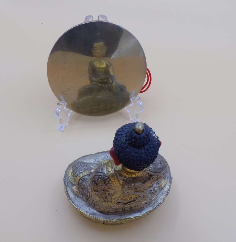 Reflection of the Buddha in the mirror