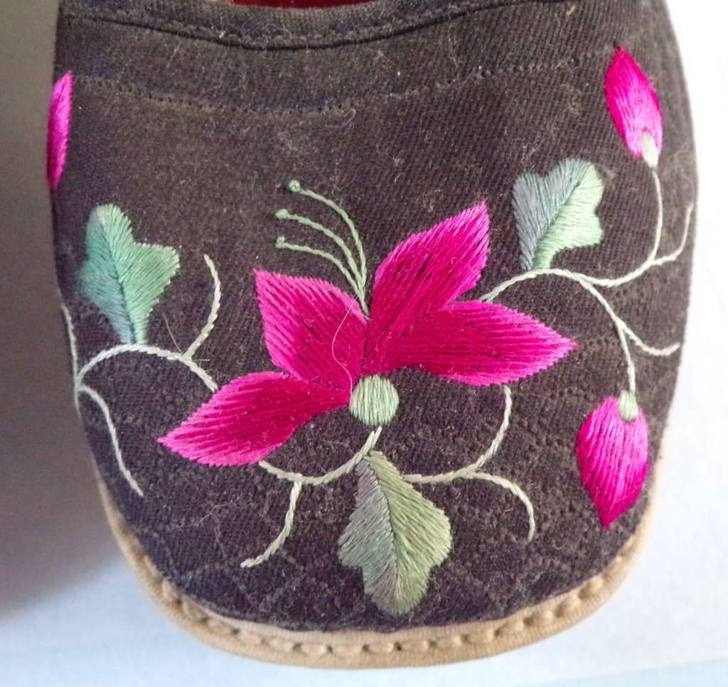 Close up shot of embroidery design on Chinese woman's cloth shoes 